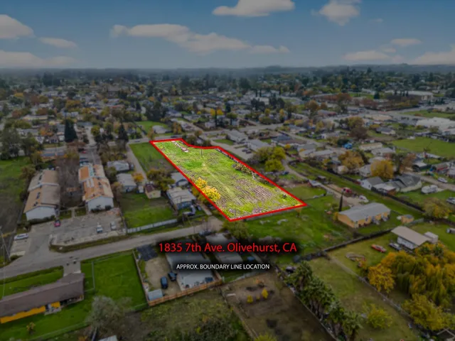 an aerial view of a residential houses with outdoor space