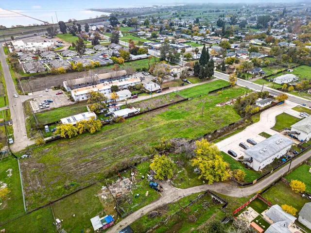 an aerial view of residential houses with outdoor space