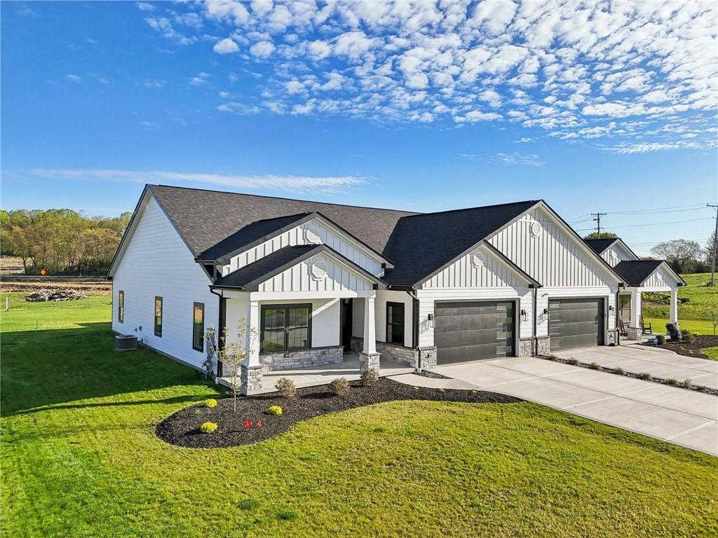 a view of a house with swimming pool and yard