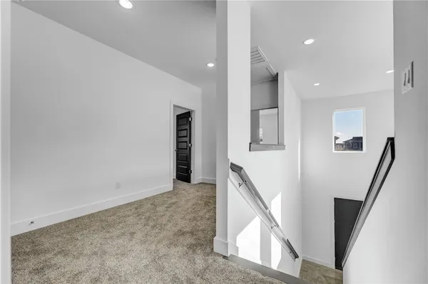 a view of a hallway with staircase