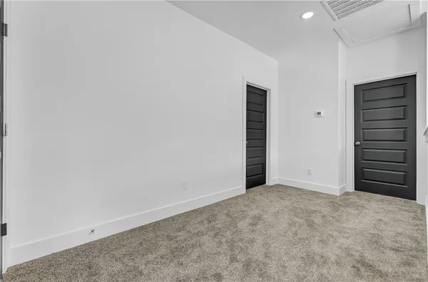 an empty room with closet area
