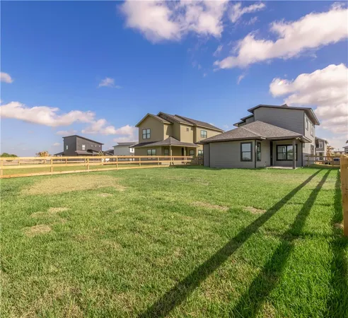 a view of a house with a big yard