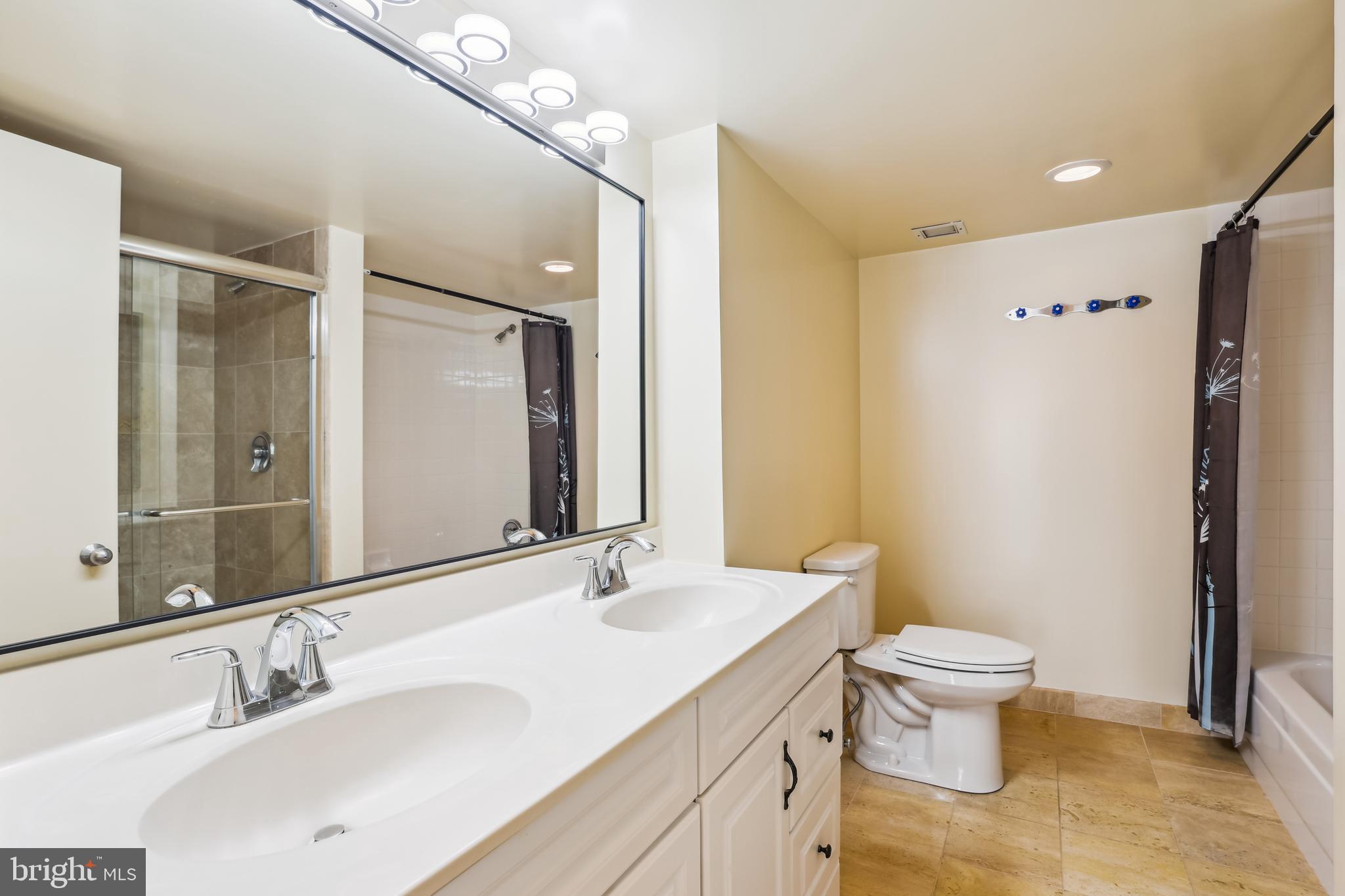 1230 23rd Street Northwest, Unit 607 Washington, DC 20037 - Photo 14 of 29 Bath with tub and shower