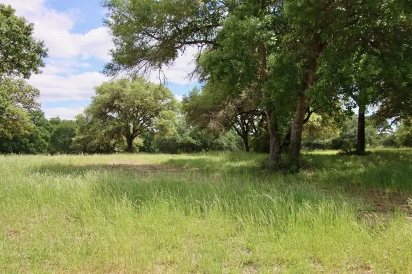 a swimming pool with outdoor seating yard and barbeque oven