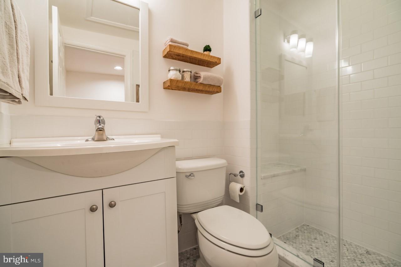 619 11th Street Northeast Washington, DC 20002 - Photo 5 of 6 a bathroom with a sink toilet and shower