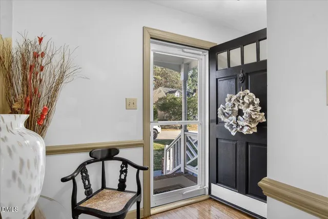 a bed room with furniture and a potted plant
