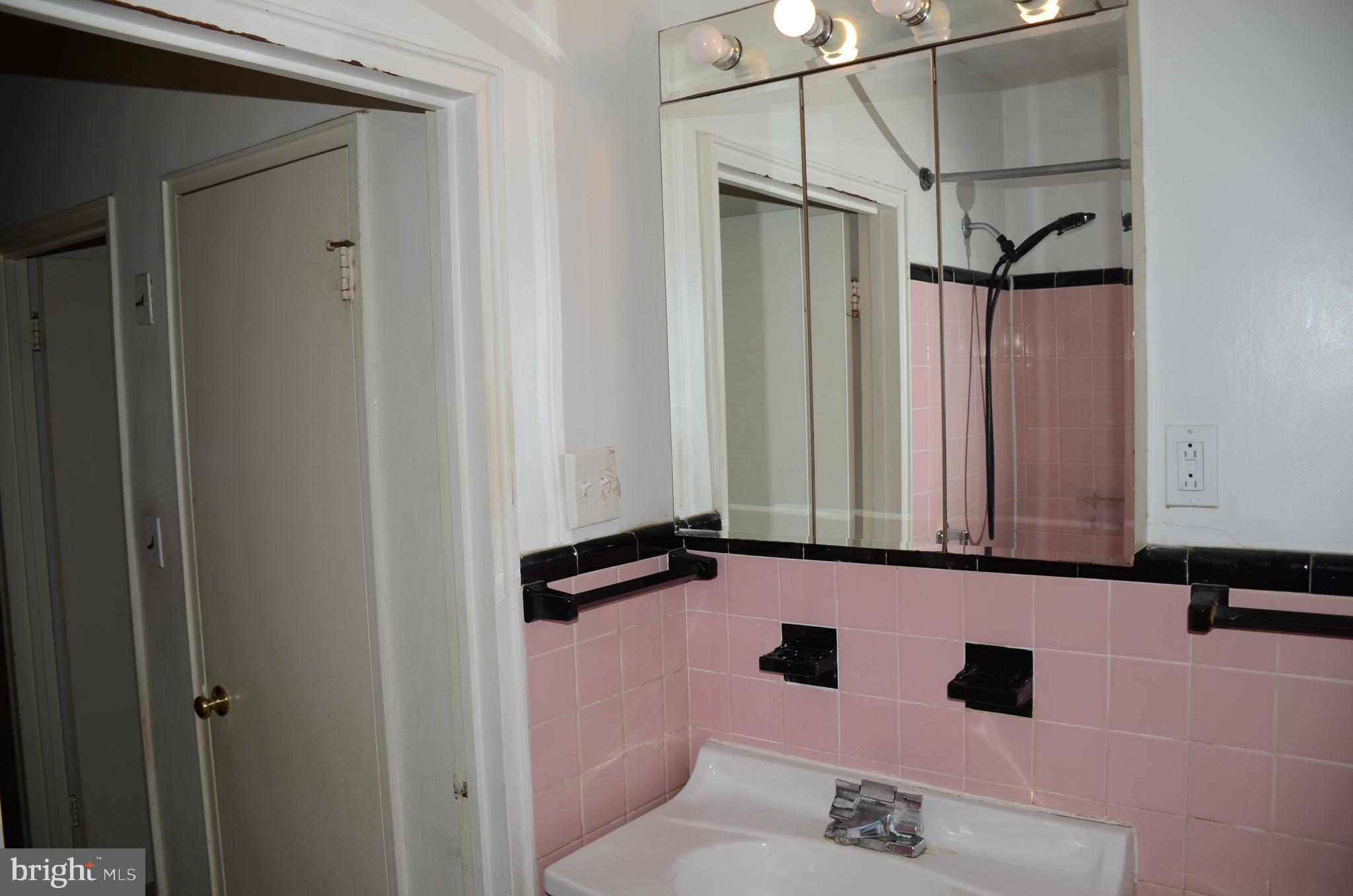 11 Homewood Road Wilmington, DE 19803 - Photo 9 of 47 a bathroom with a sink and a mirror