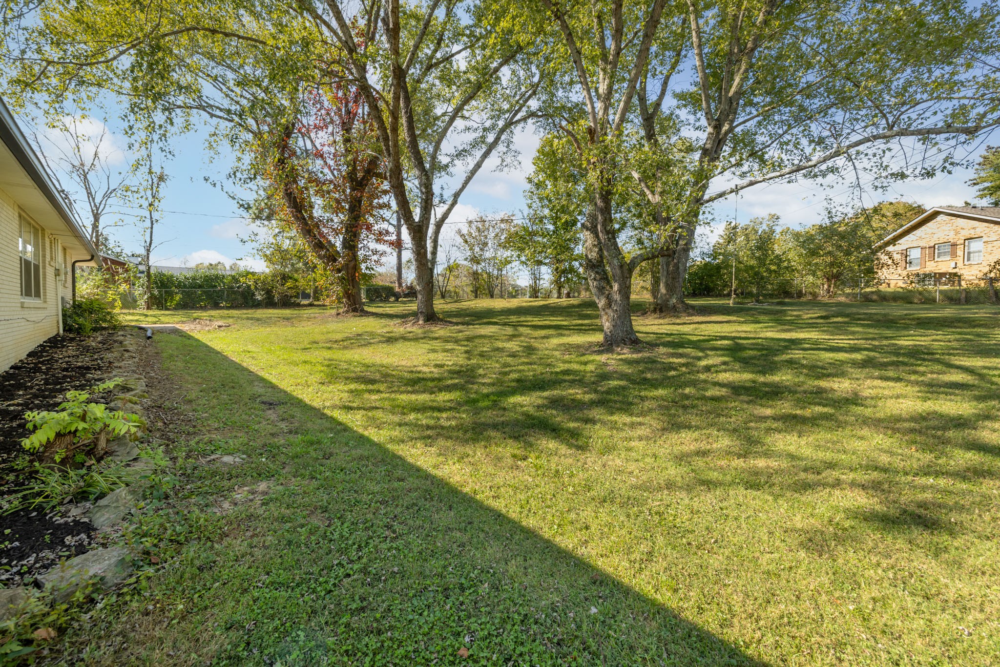 1015 Lockertsville Road Ashland City, TN 37015 - Photo 17 of 72 a yard with trees in the background
