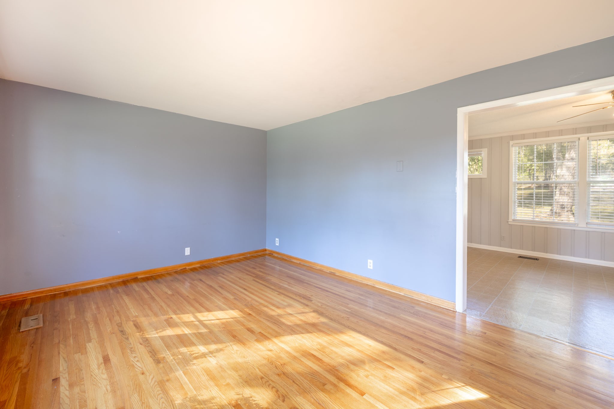 1015 Lockertsville Road Ashland City, TN 37015 - Photo 20 of 72 a view of an empty room with wooden floor and a window