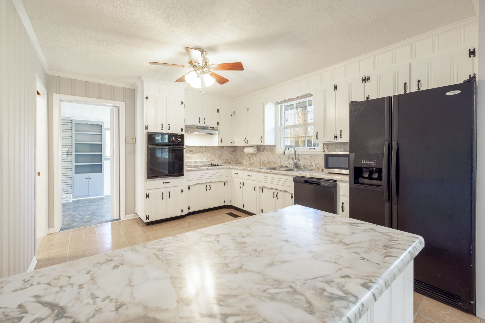 1015 Lockertsville Road Ashland City, TN 37015 - Photo 33 of 72 a kitchen with stainless steel appliances a refrigerator sink and cabinets