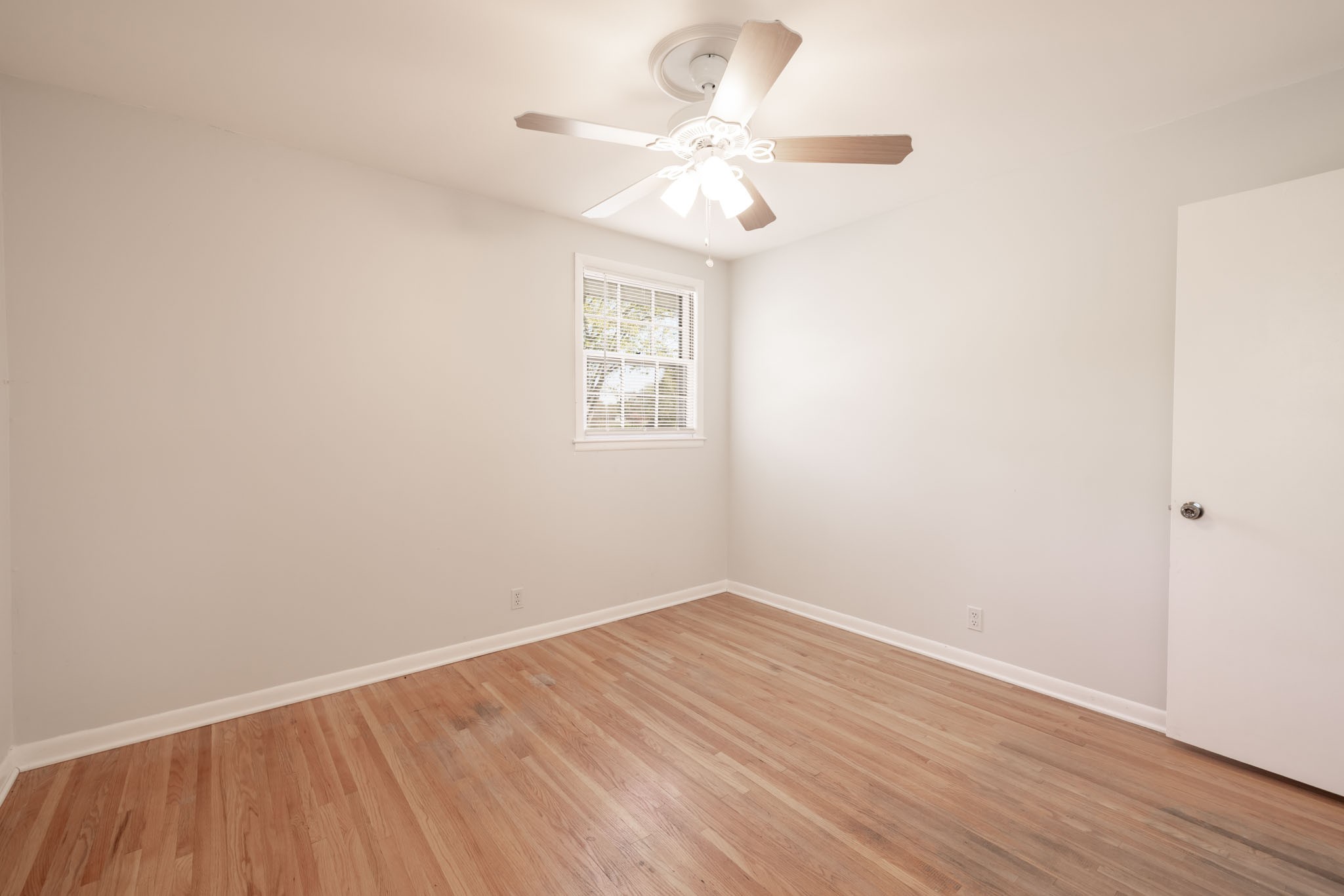 1015 Lockertsville Road Ashland City, TN 37015 - Photo 38 of 72 a view of a room with wooden floor and a ceiling fan