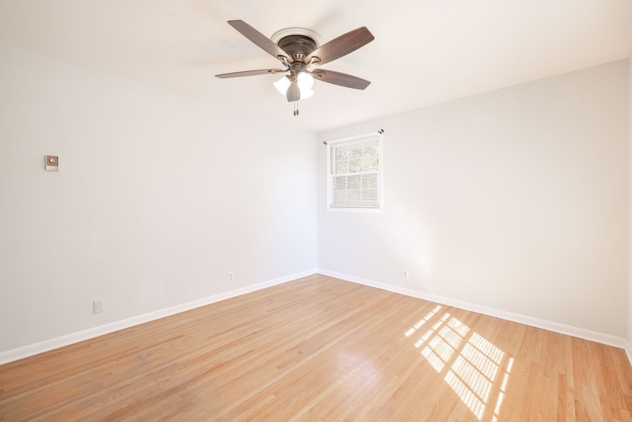 1015 Lockertsville Road Ashland City, TN 37015 - Photo 44 of 72 an empty room with wooden floor and windows
