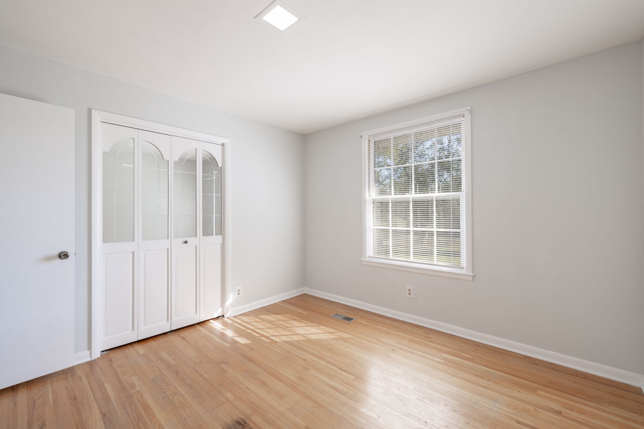 1015 Lockertsville Road Ashland City, TN 37015 - Photo 48 of 72 an empty room with wooden floor and windows