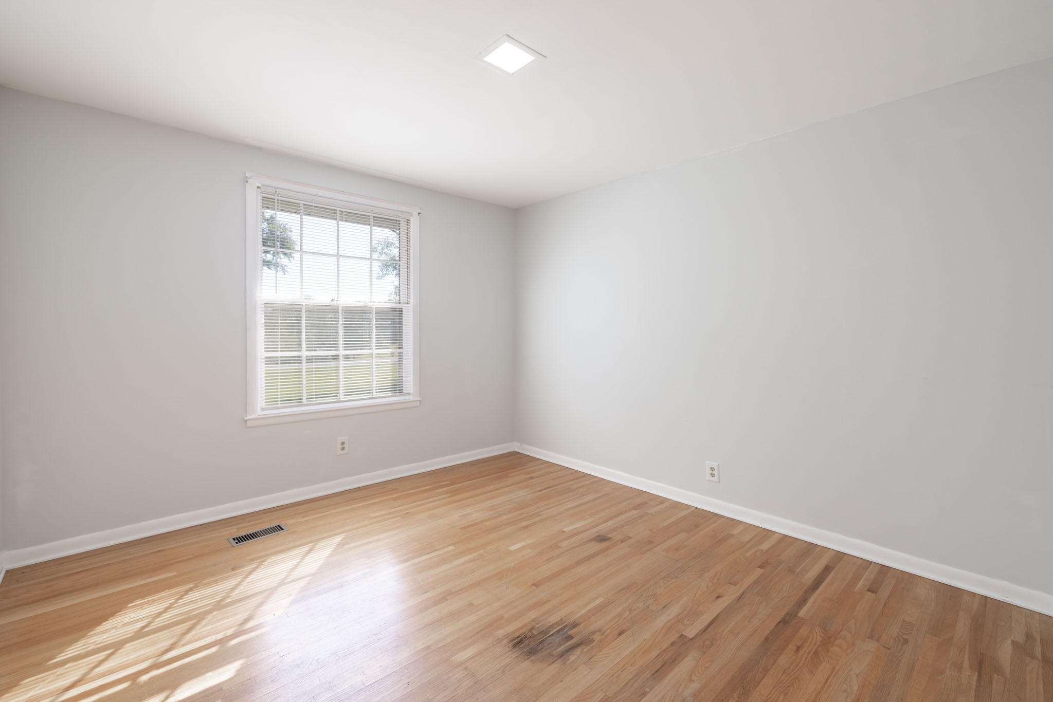 1015 Lockertsville Road Ashland City, TN 37015 - Photo 49 of 72 an empty room with wooden floor and windows