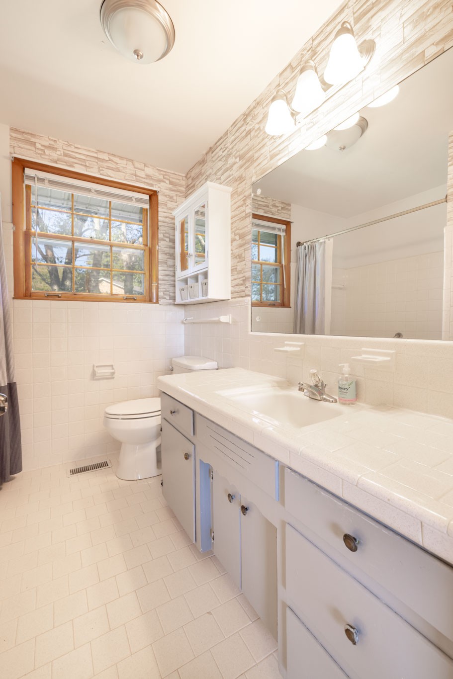 1015 Lockertsville Road Ashland City, TN 37015 - Photo 50 of 72 a bathroom with a granite countertop sink mirror and a toilet