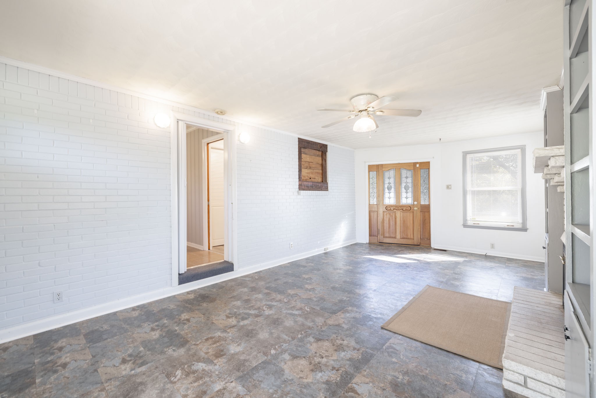 1015 Lockertsville Road Ashland City, TN 37015 - Photo 52 of 72 an empty room with windows and ceiling fan