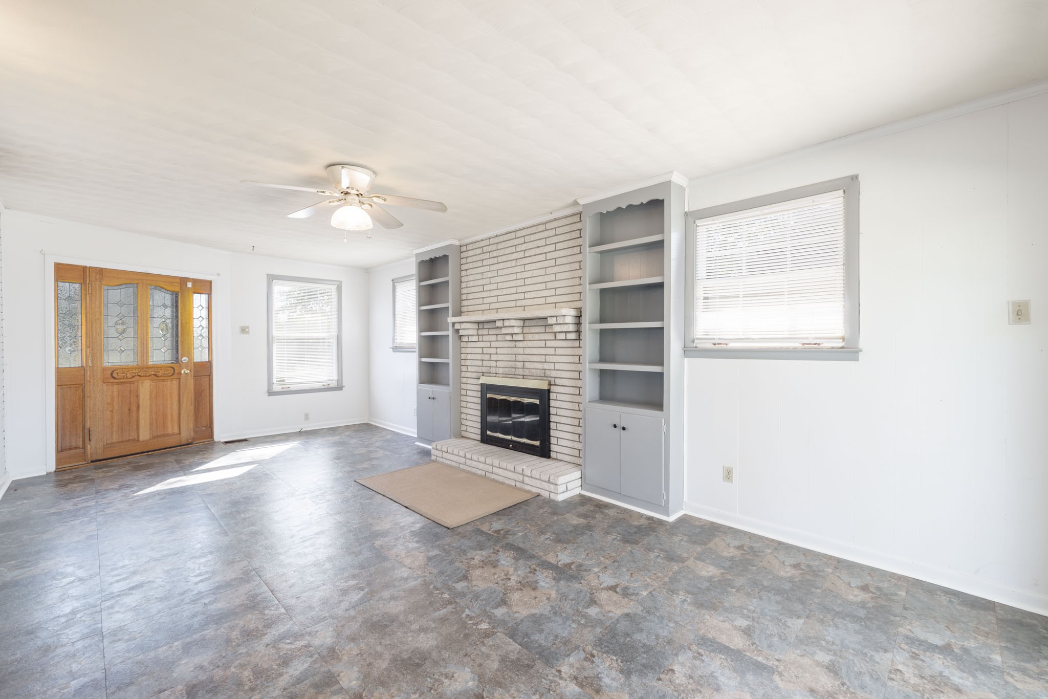1015 Lockertsville Road Ashland City, TN 37015 - Photo 53 of 72 an empty room with windows and fireplace