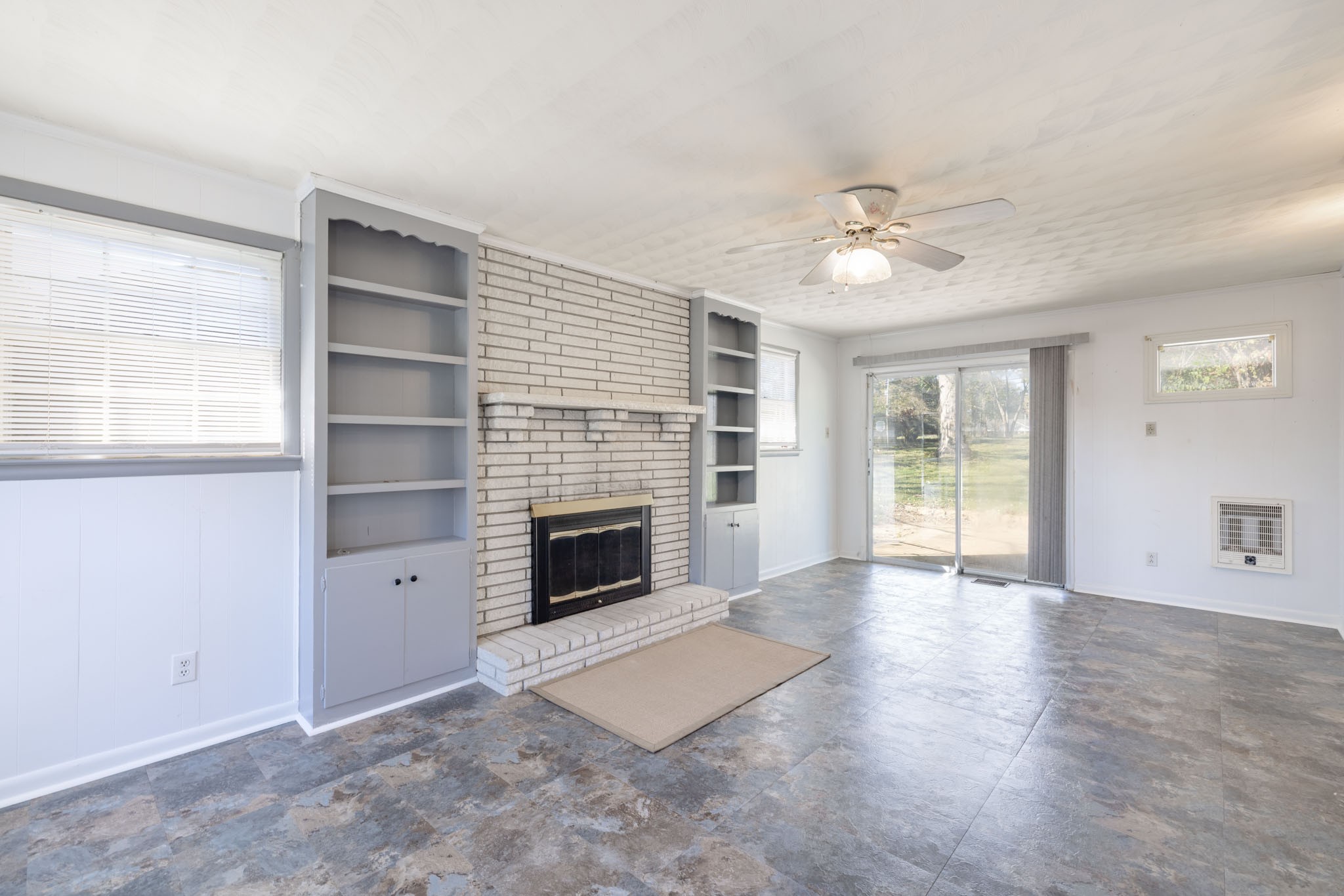 1015 Lockertsville Road Ashland City, TN 37015 - Photo 54 of 72 a view of an empty room with a fireplace and a window