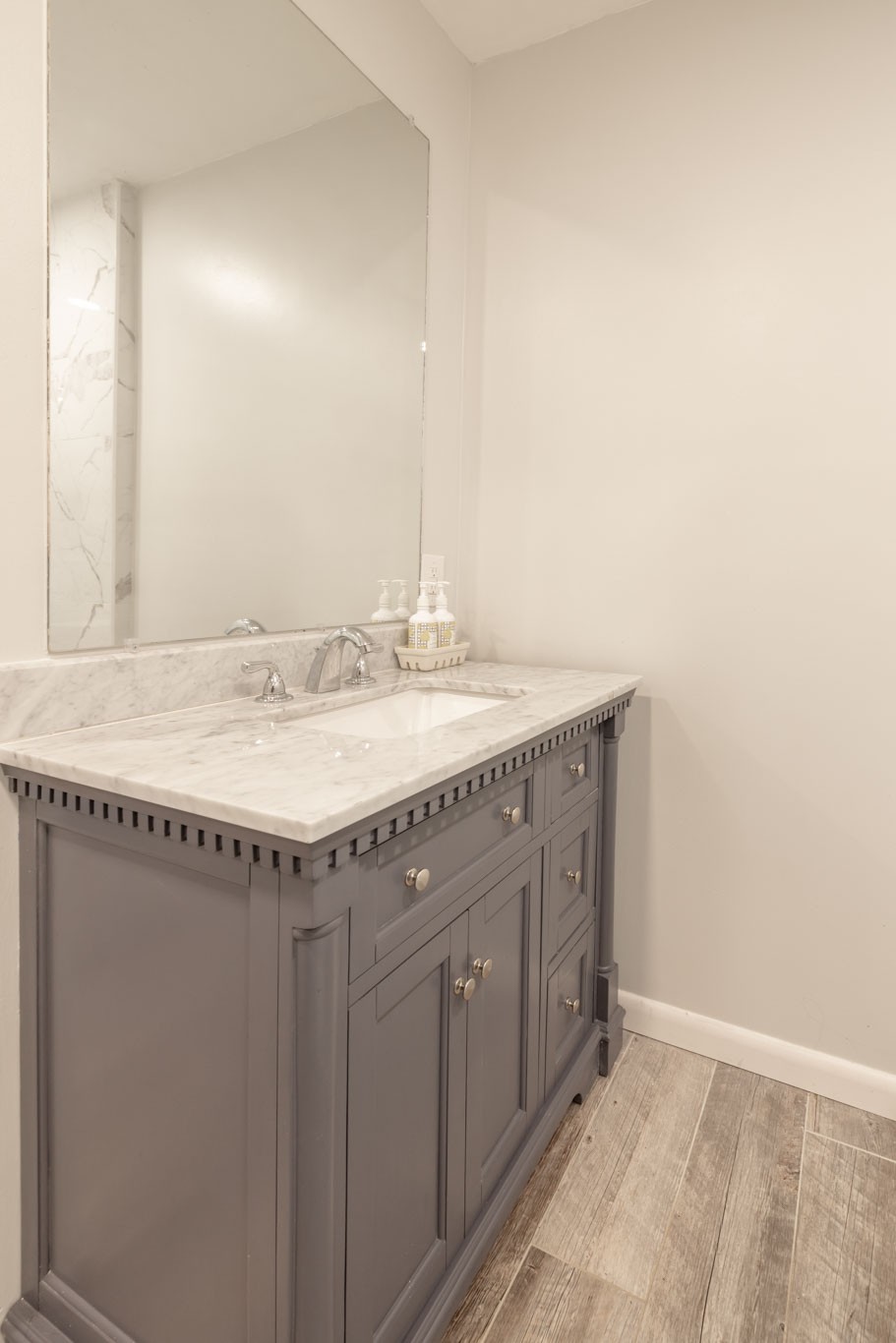 1015 Lockertsville Road Ashland City, TN 37015 - Photo 58 of 72 a bathroom with a granite countertop sink and a mirror