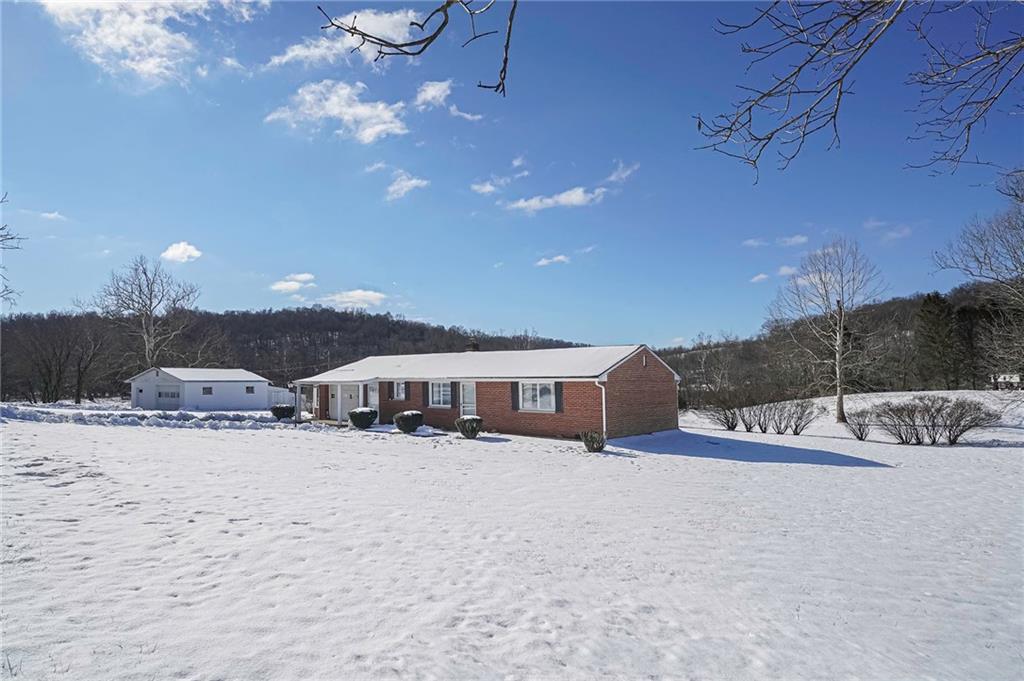 655 Joffre Cherry Valley Road Burgettstown, PA 15021 - Photo 1 of 25 a view of a house with a yard and covered with snow