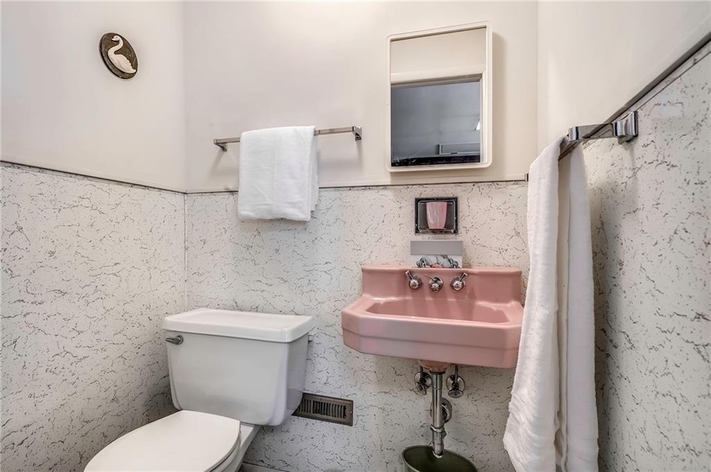 655 Joffre Cherry Valley Road Burgettstown, PA 15021 - Photo 18 of 25 a bathroom with a sink toilet a mirror and shower
