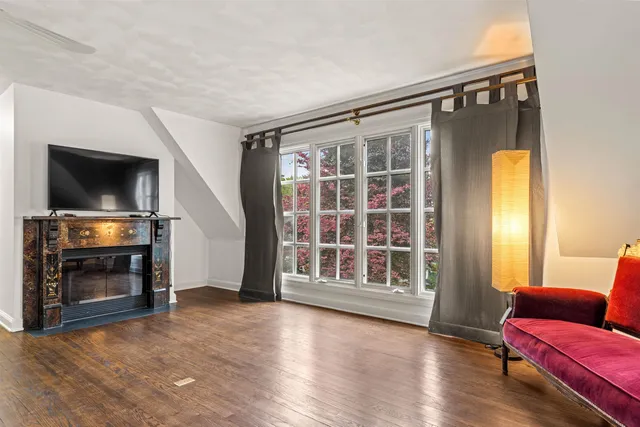 a view of livingroom with furniture wooden floor window and fire place