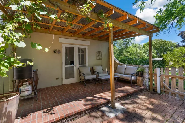 a patio with table and chairs