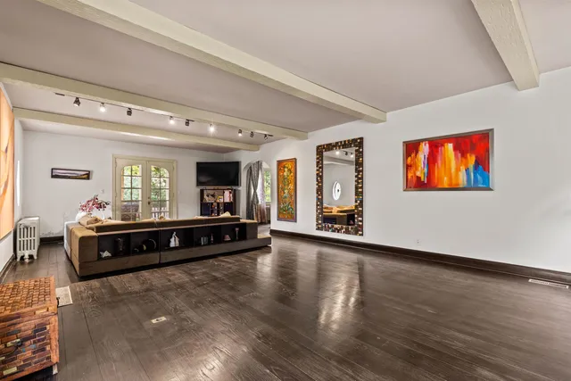 a living room with furniture window and flat screen tv