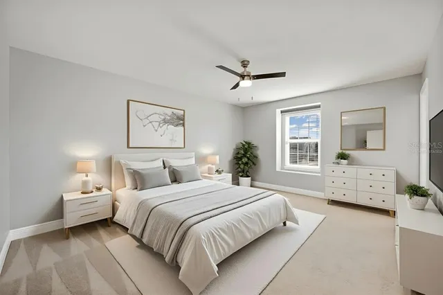 a bedroom with a large bed and a window