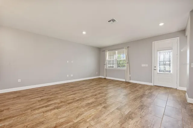 a view of an empty room with a window