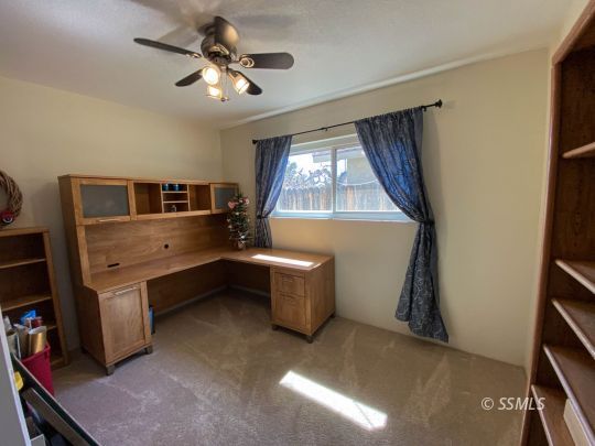 218 South Lilac Street Ridgecrest, CA 93555 - Photo 21 of 43 a living room with furniture and window