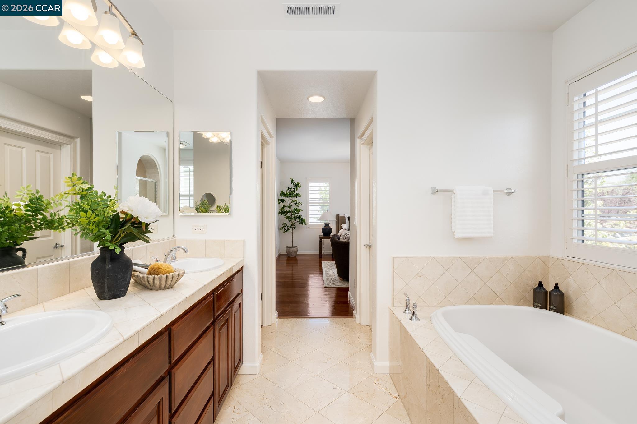 2359 Magnolia Bridge Drive San Ramon, CA 94582 - Photo 21 of 44 a bathroom with a tub sink and mirror