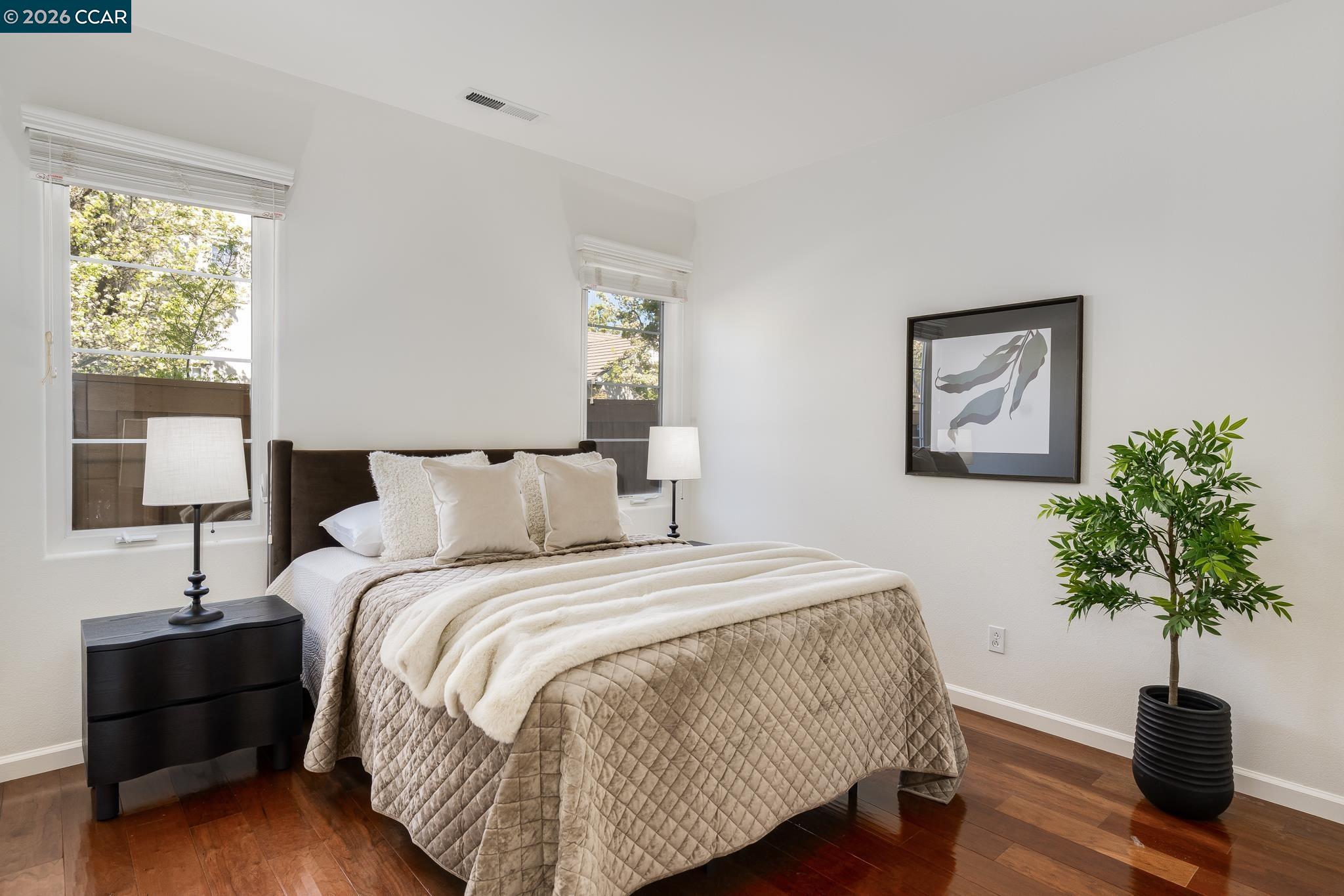 2359 Magnolia Bridge Drive San Ramon, CA 94582 - Photo 24 of 44 a bedroom with a bed lamp and a potted plant