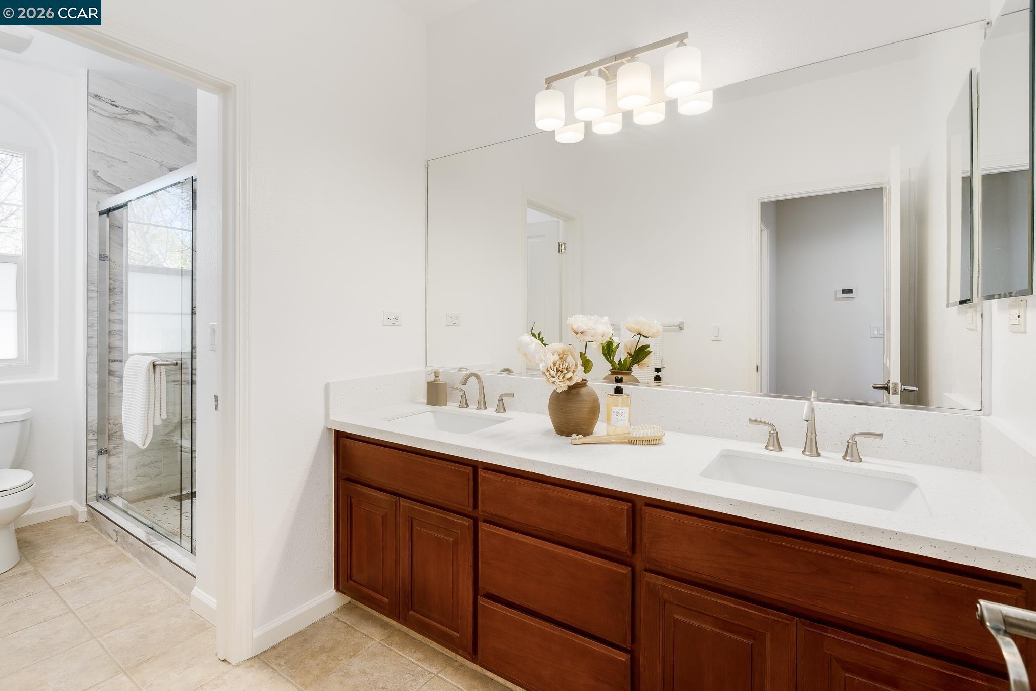 2359 Magnolia Bridge Drive San Ramon, CA 94582 - Photo 25 of 44 a bathroom with double vanity and a mirror