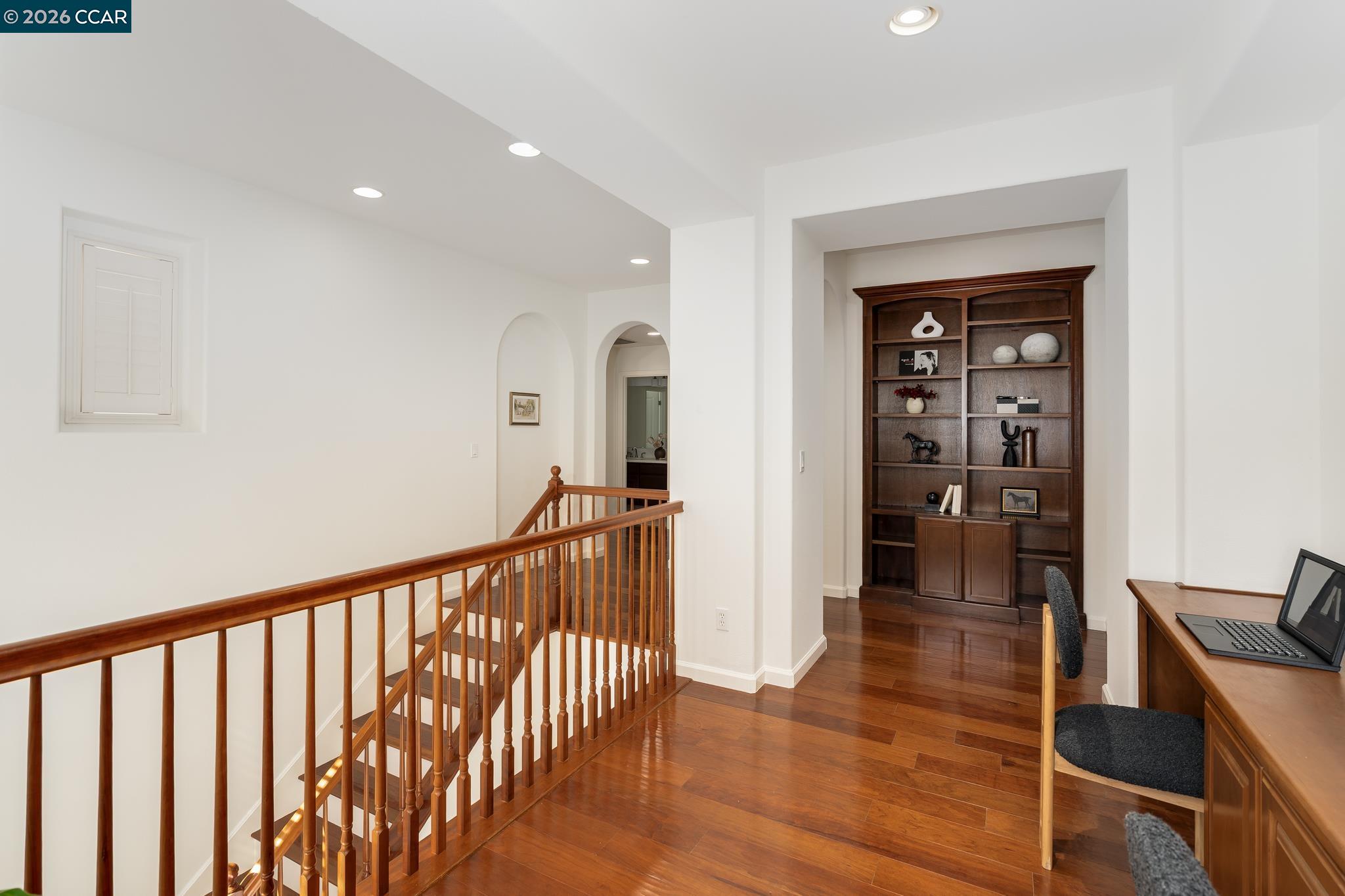 2359 Magnolia Bridge Drive San Ramon, CA 94582 - Photo 27 of 44 a view of a hallway with wooden floor and furniture