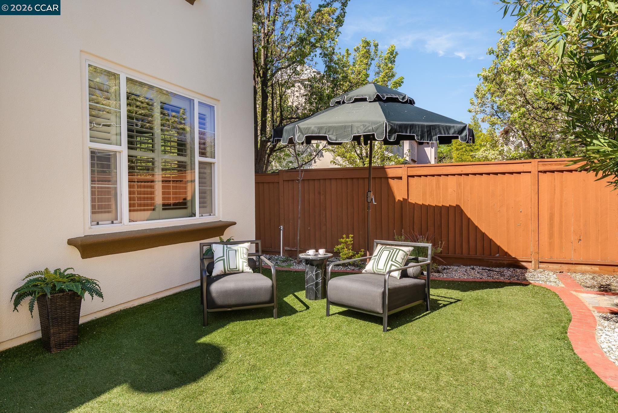 2359 Magnolia Bridge Drive San Ramon, CA 94582 - Photo 29 of 44 a backyard of a house with table and chairs