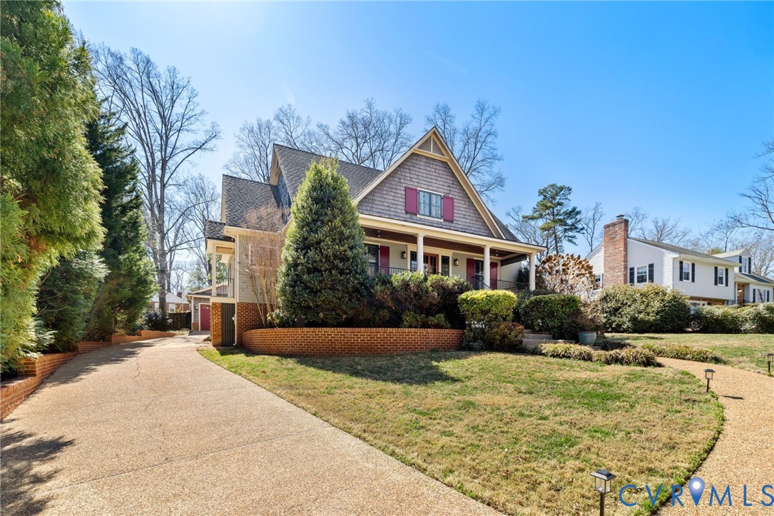 8947 Cherokee Road Richmond, VA 23235 - Photo 3 of 45 a front view of a house with a yard
