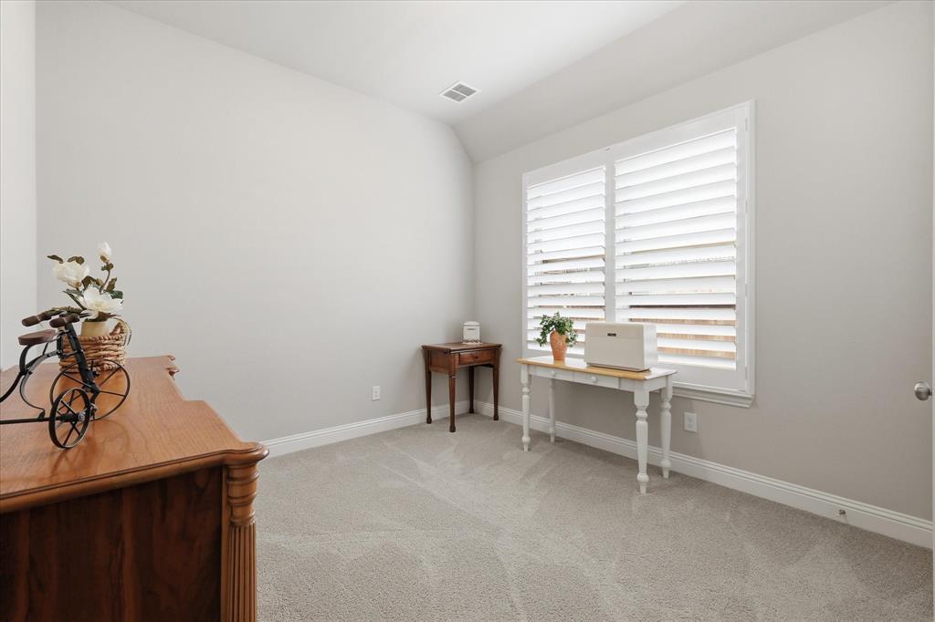 9708 Surveyor Road Oak Point, TX 75068 - Photo 28 of 34 Room featuring light-toned carpeting, neutral wall paint, and white baseboards