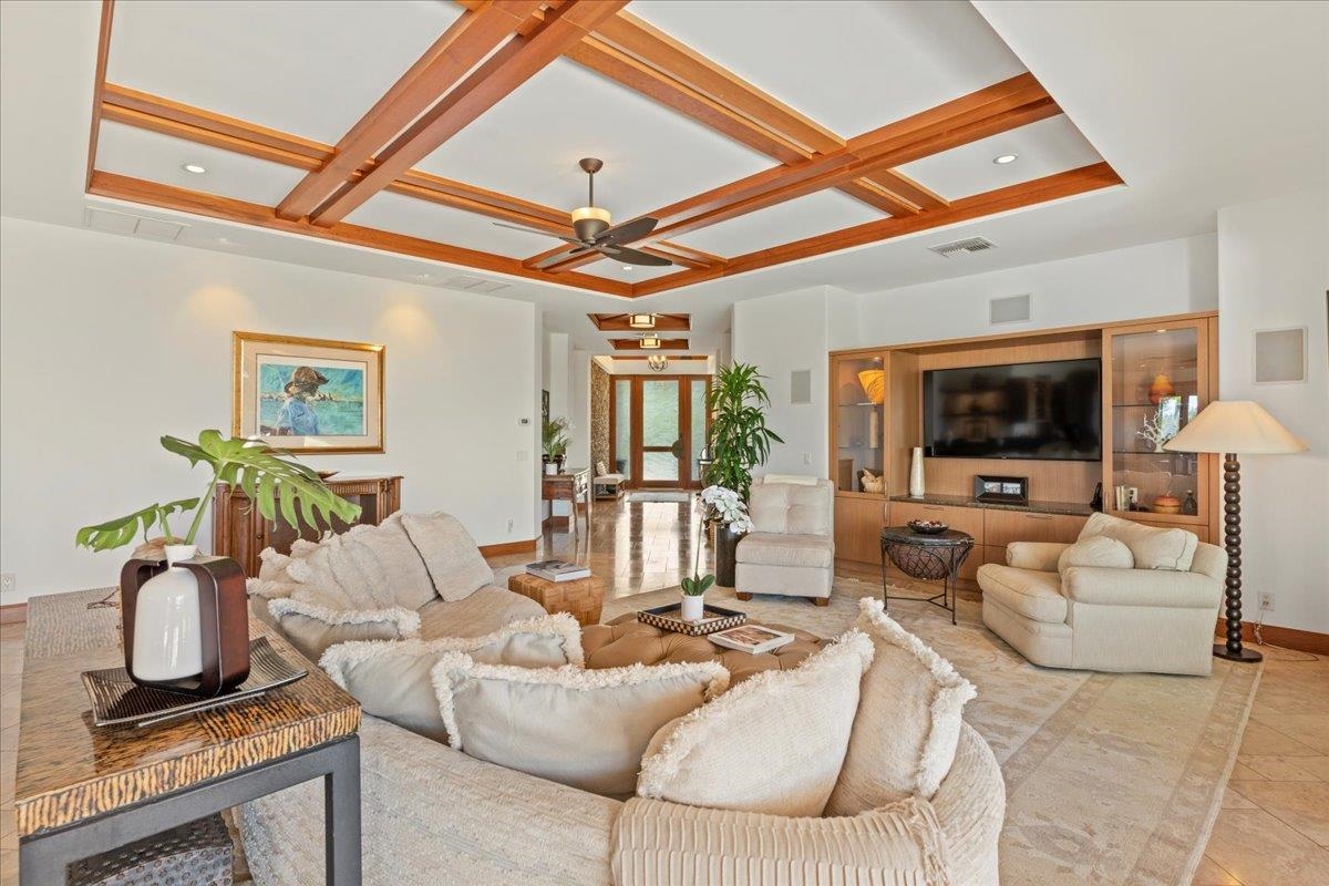 238 Crestview Road Lahaina, HI 96761 - Photo 15 of 48 a living room with furniture a chandelier and a flat screen tv