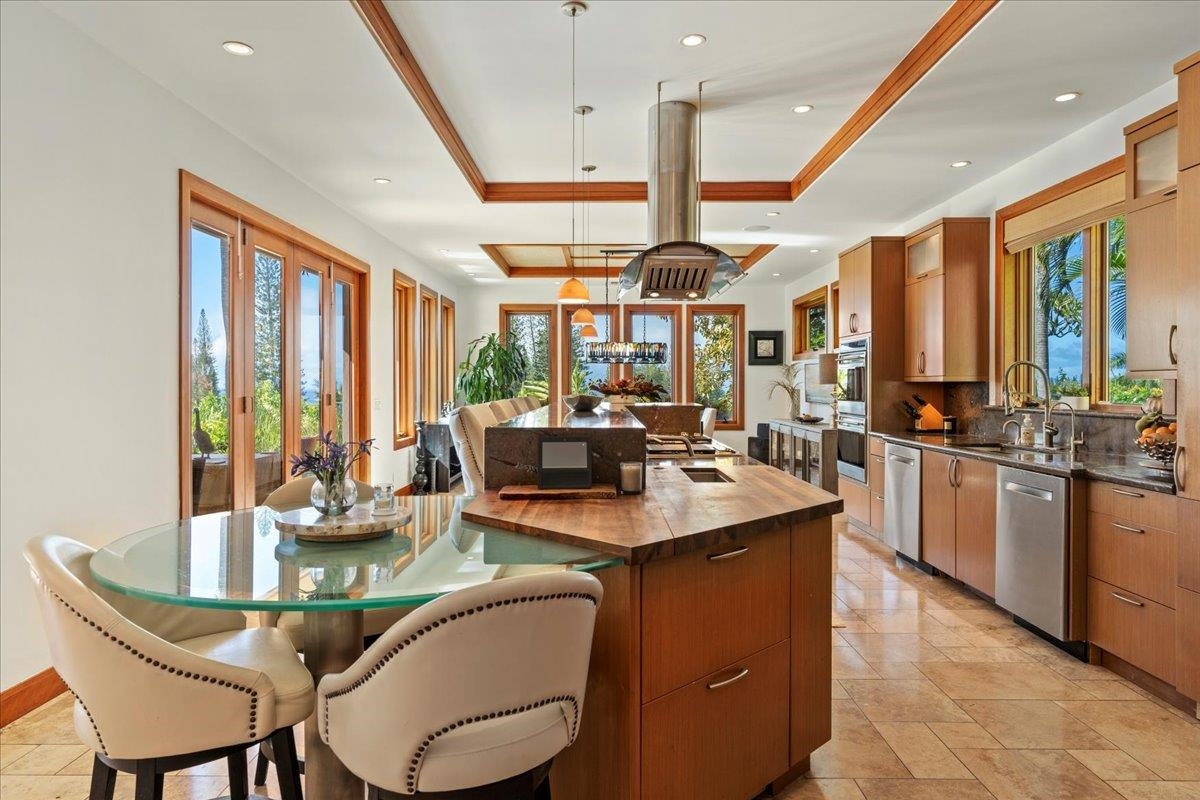 238 Crestview Road Lahaina, HI 96761 - Photo 16 of 48 a dining table with chairs and window