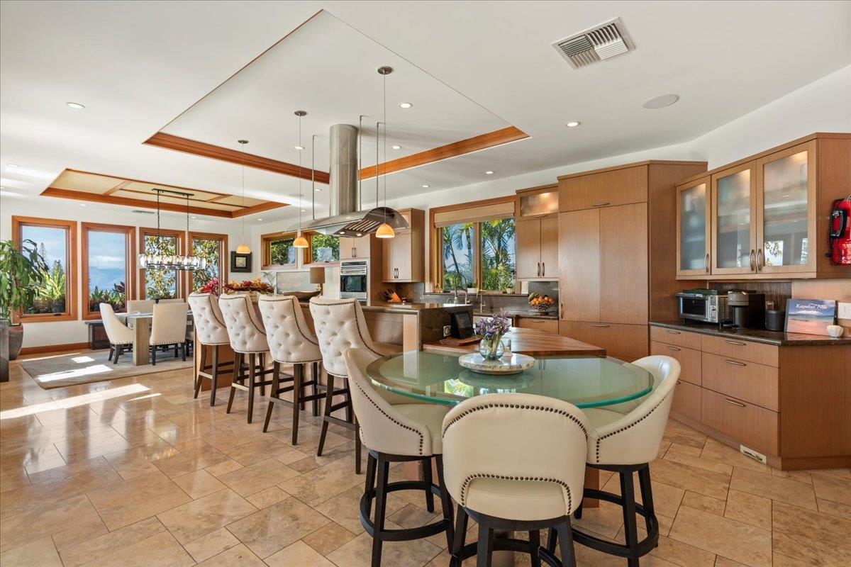 238 Crestview Road Lahaina, HI 96761 - Photo 17 of 48 a dining room with furniture and a floor to ceiling window