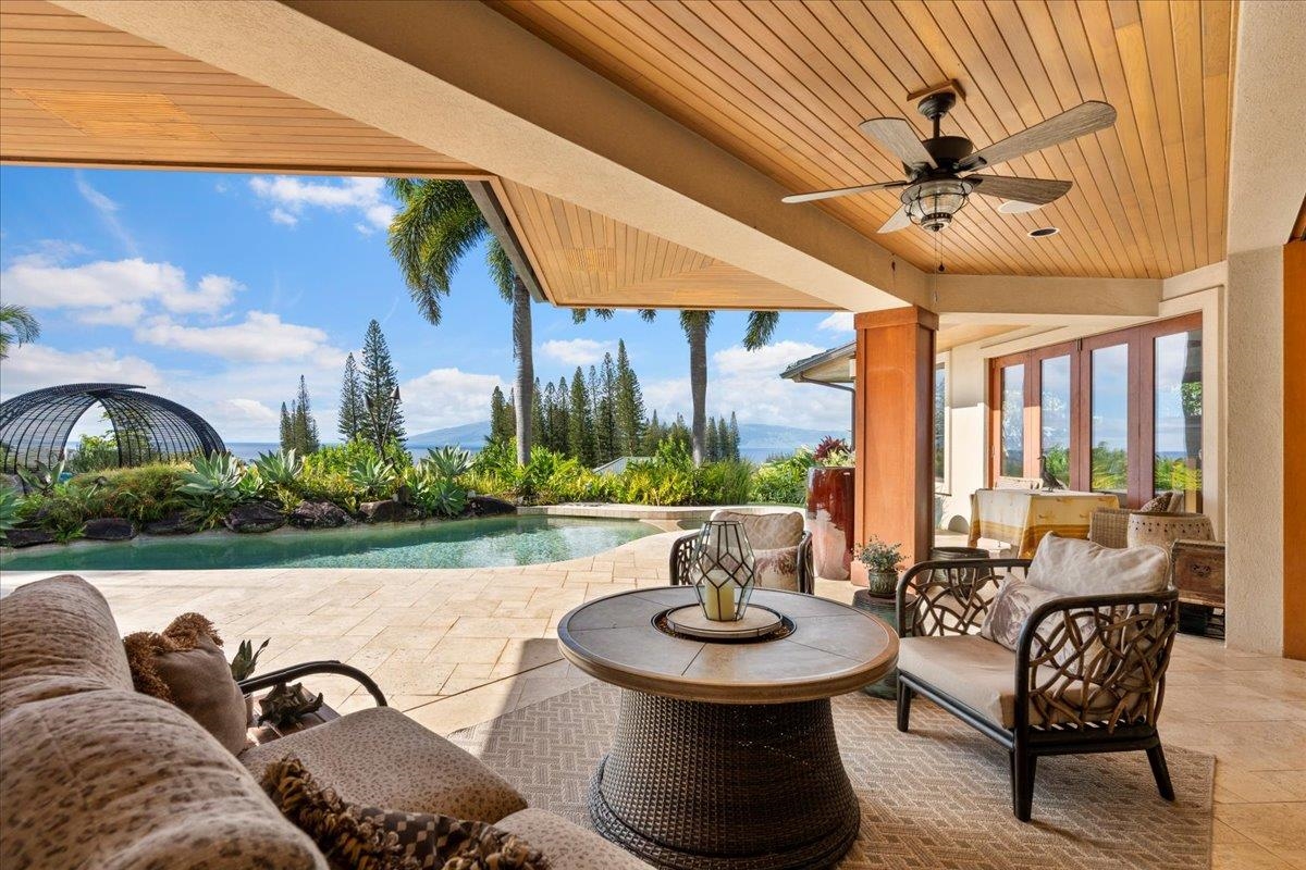 238 Crestview Road Lahaina, HI 96761 - Photo 2 of 48 a living room with patio furniture and a large window