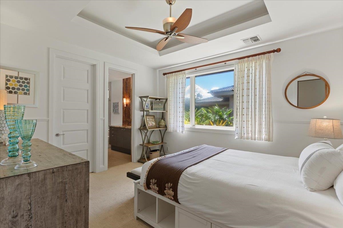 238 Crestview Road Lahaina, HI 96761 - Photo 30 of 48 a bedroom with a large bed and a chandelier