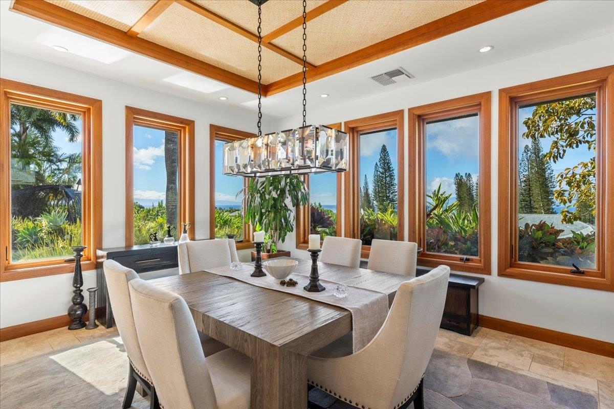238 Crestview Road Lahaina, HI 96761 - Photo 3 of 48 a dining room with wooden floor glass table and chairs