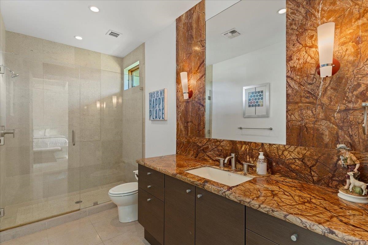 238 Crestview Road Lahaina, HI 96761 - Photo 31 of 48 a bathroom with a granite countertop sink toilet and shower