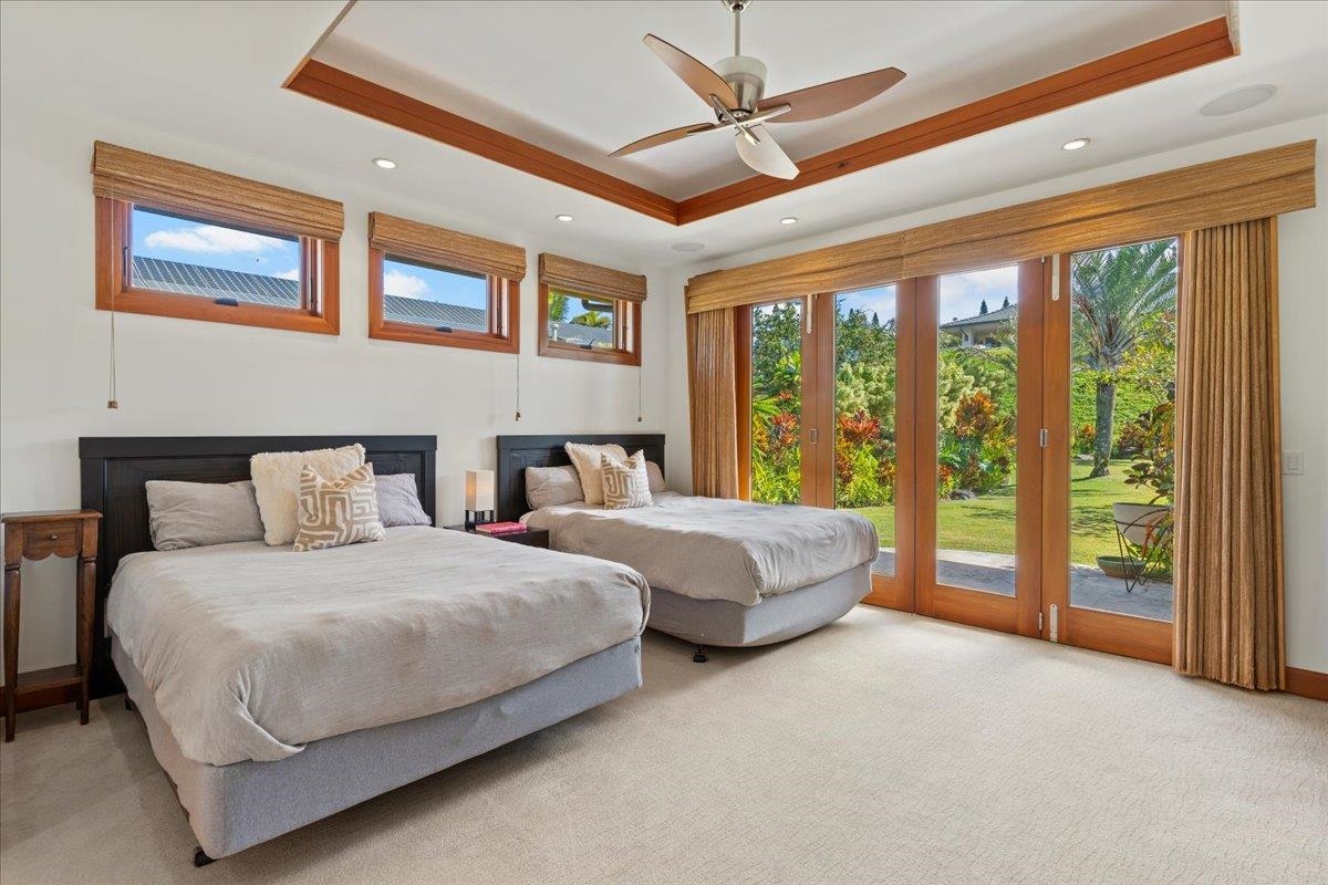 238 Crestview Road Lahaina, HI 96761 - Photo 34 of 48 a bedroom with two large bed and a large window