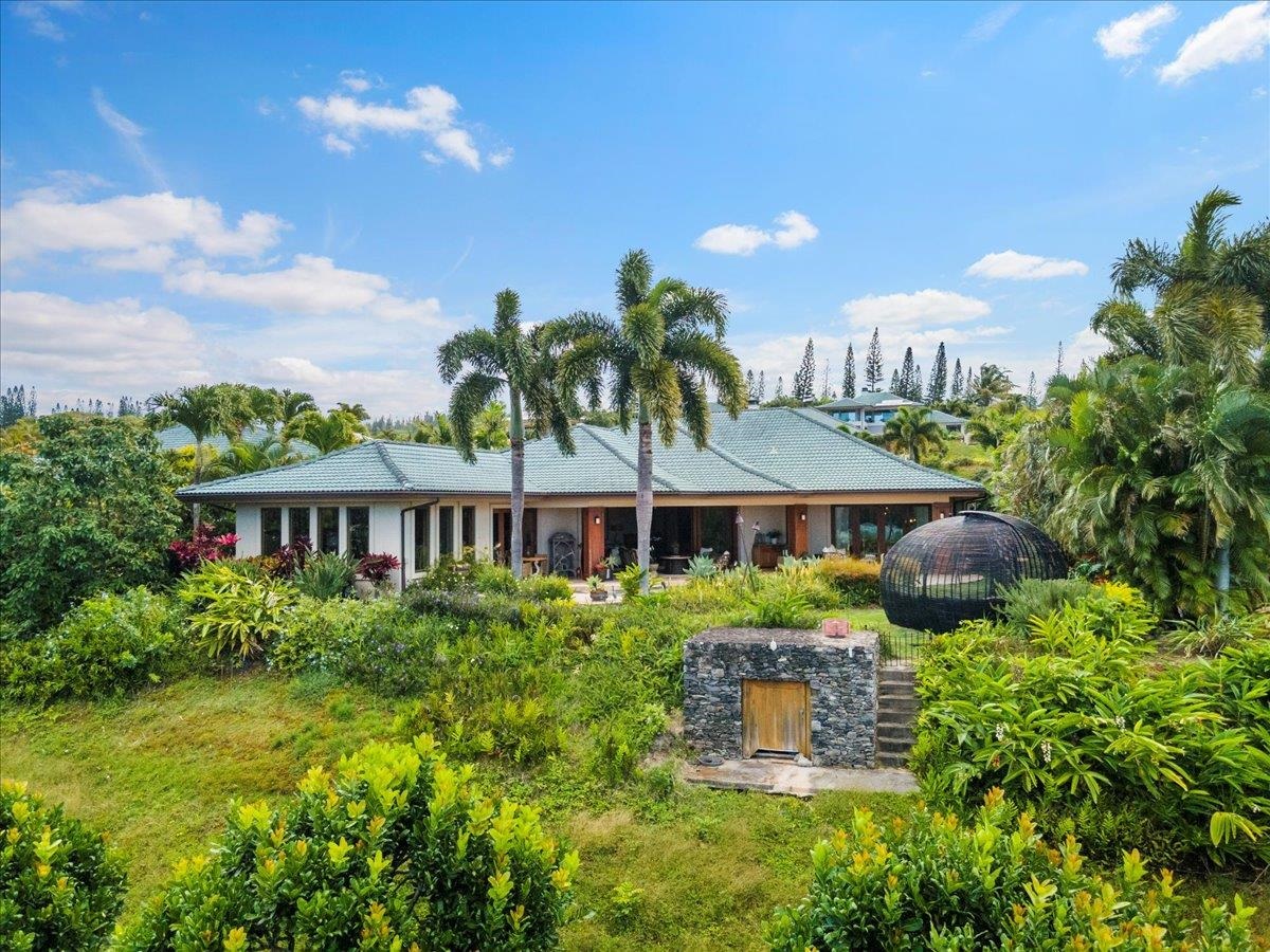 238 Crestview Road Lahaina, HI 96761 - Photo 39 of 48 a front view of a house with a yard and potted plants
