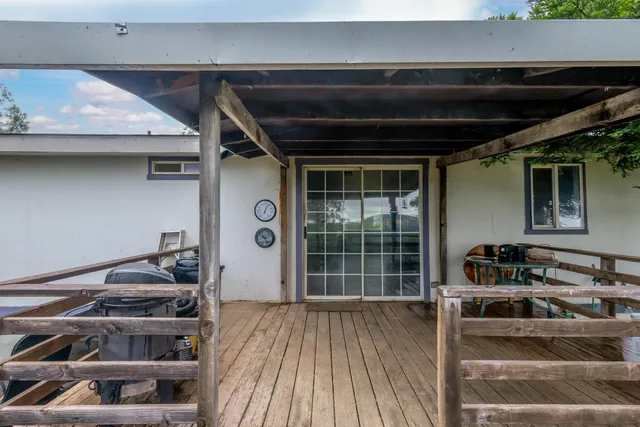 a kitchen with a stove and a wooden floor