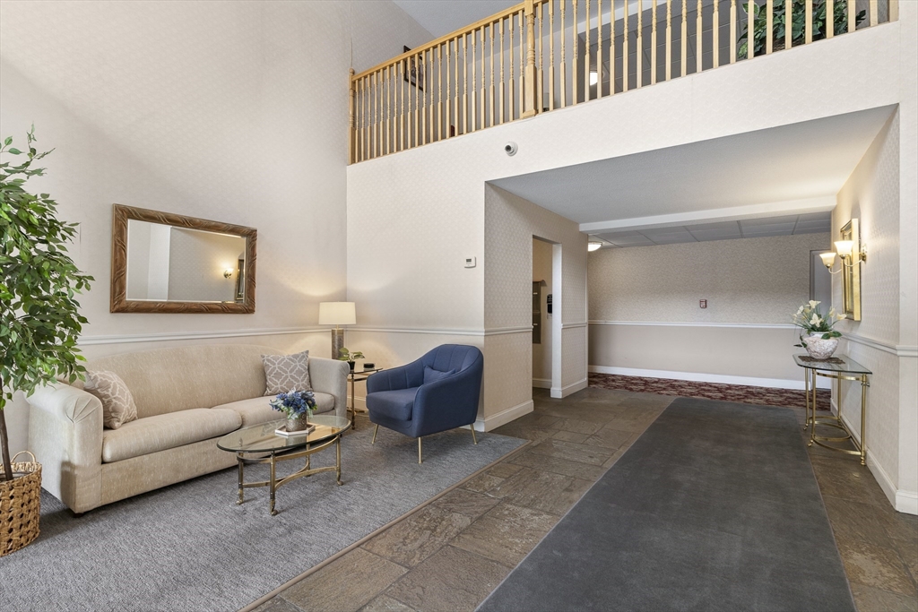 3 Summit Drive, Unit 67 Reading, MA 01867 - Photo 13 of 17 a living room with furniture