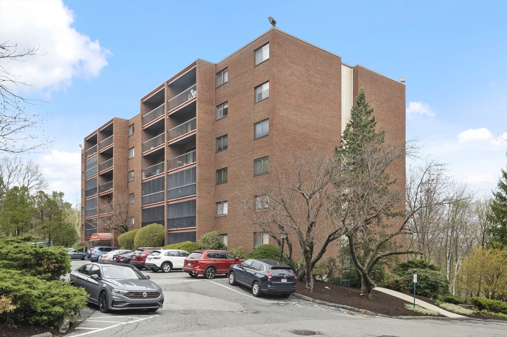 3 Summit Drive, Unit 67 Reading, MA 01867 - Photo 14 of 17 a car parked in front of a building